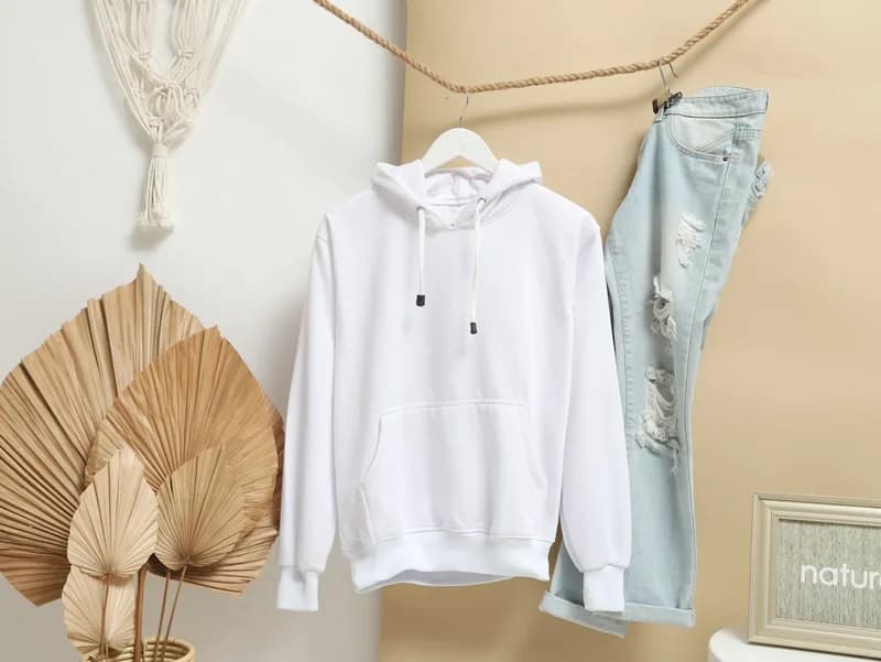 White hoodie on a hanger
